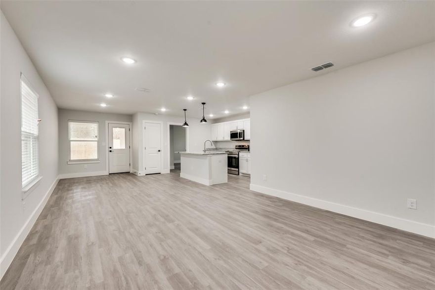 GREAT Investment Opportunity- Tenant in Place. Recent home construction within walking distance to Downtown, Police Station and Public Library! HUGE BACKYARD. This charming 1-story, open floor plan features 3- bedrooms and 2 baths with kitchen island, separate pantry and separate utility room. Designed for low-maintenance, amenities include 3cm granite countertops, stainless steel appliances, wide-plank luxury vinyl plank flooring, walk-in closet at primary bedroom, dual sinks at primary bathroom, and upgraded interior door and trim package. High quality construction standards include two-stage HVAC system, post-tension engineered foundation and foam insulation at attic and exterior walls.