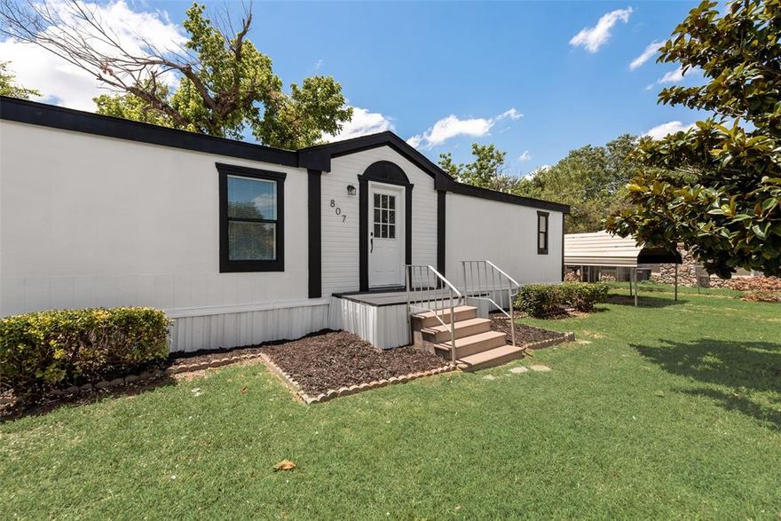 Welcome to 807 1st Street, a beautifully remodeled, move-in ready 3 bedroom, 2 bathroom property. Upgrades include a full remodel with new flooring, countertops, fixtures, paint, appliances, and exterior skirting. The primary suite offers a comfortable space and large bathroom with dual vanities, freestanding soaking tub, and a walk in shower. The two secondary bedrooms make great space for family, guest, or a home office. The kitchen and living space boasts plenty of cabinetry, stainless steel appliances, and dining space for dinners with family and friends. Enjoy the charm of small town living in this bright, updated space!