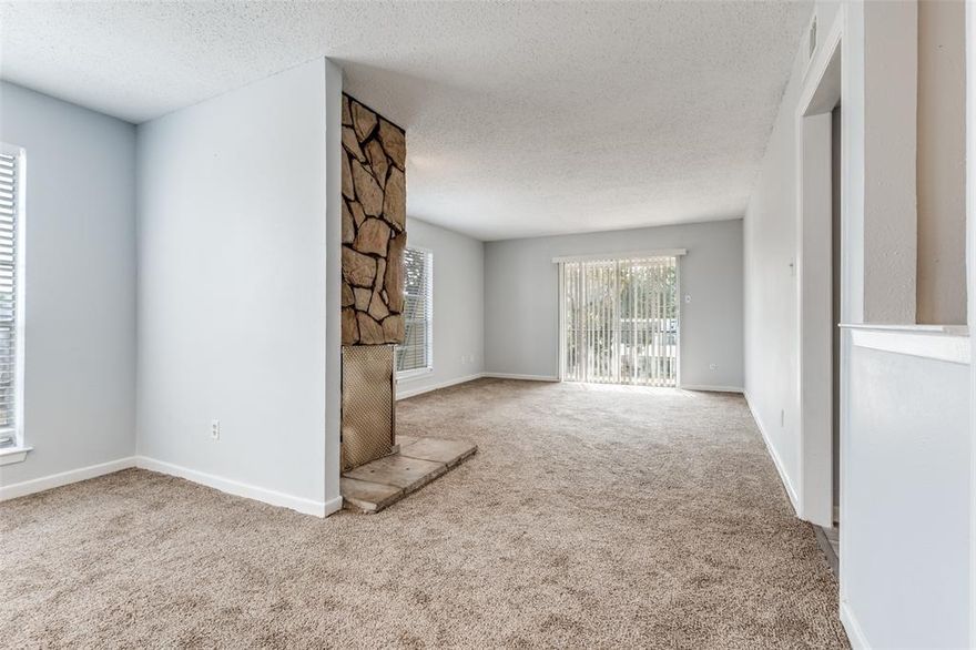 Welcome to this recently renovated second-floor condo offering modern comfort and style. This spacious unit features two bedrooms and two full baths, complete with walk-in closets and full washer and dryer hookups for added convenience. Enjoy gatherings in the dining room and cozy up by the fireplace in the adjacent living room. This condo is a perfect blend of functionality and charm, ideal for anyone looking to enjoy living in Dallas. Don't miss out on this opportunity to make this your new home!