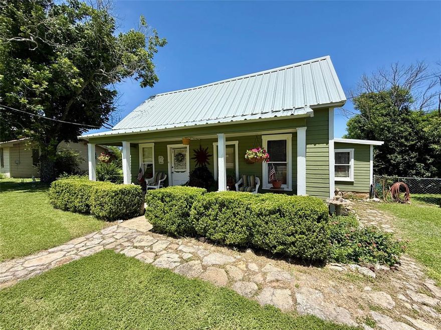 Welcome to 713 N Mesquite Street, a charming vintage home located on a spacious 1.4-acre lot right inside the city limits of Hico, Texas. Built in the early 1900s, this two-bedroom, one-bath home offers 1,127 square feet of inviting living space, filled with character and comfort. Enjoy peaceful mornings and relaxing evenings on the beautiful back porch overlooking your very own fish pond and shaded yard—a true sanctuary in town. The property also features a versatile storage building and plenty of open space, making it ideal for gardening, hobbies, or simply enjoying a little extra room to roam while staying close to schools, shops, and restaurants. This unique property combines the convenience of in-town living with the privacy and charm of a larger lot. Priced at $274,900, it’s a rare opportunity to own a historic home on acreage within Hico’s city limits.