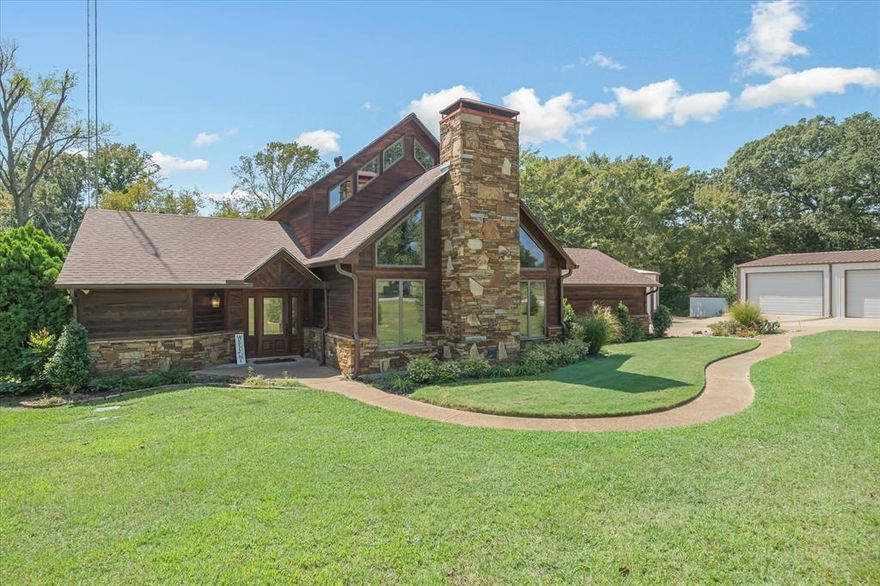 Discover the perfect blend of entertaining, functionality, & rustic charm with this exquisite retreat situated on 2 +- acres. The property is thoughtfully designed to accommodate an endless array of possibilities.  The inviting design highlights a spacious living area with soaring wooden vaulted ceilings and a striking stone WBFP as the centerpiece.  The open kitchen and dining concept is a chefs dream - perfect for gatherings, complete with a commercial-grade gas range, double oven, breakfast bar, and an abundance of cabinetry for storage.  The primary suite is conveniently located downstairs that leads into the ensuite with dual sinks, walk-in closet, & beautifully tiled shower featuring multiple shower-heads and body jets providing a spa-like experience.  Upstairs offers 2 additional bedrooms, a full bathroom, and a versatile bonus area filled with natural light.  Step outside and enjoy the oversized back patio connecting to the separate 12x30 guest house ideal for extended stays, mother-in-law suite, or rental income.  This property is built for both storage and productivity, featuring a 2-car garage and two spacious insulated shops—measuring 40x60 and 34x30. One shop is outfitted with a professional-grade automobile lift, making it ideal for mechanics, car enthusiasts, or hobbyists. A wide concrete driveway ensures easy access and provides ample parking for guests, equipment, or additional vehicles.  A whole-house generator, powered by its own dedicated propane tank, provides peace of mind and reliability. Designed to operate the entire 1,928 sq ft home as well as the guest house and all additional buildings on the property, this system ensures uninterrupted comfort and functionality no matter the conditions.  This home isn’t just a residence—it’s a lifestyle. Whether you’re relaxing fireside, enjoying the loft’s scenic views, or tackling projects in the shop, this property provides the perfect balance and rare combination for comfort and utility!