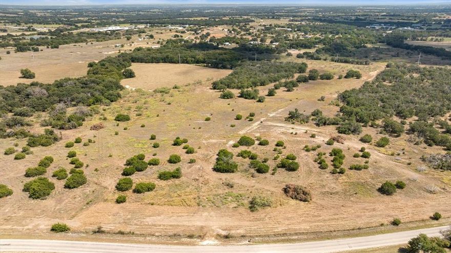 Tract 2 is 2.002 acres. Power is being brought along County Road for future access as an included feature. All Lots are 2-3 acres Tracts. Great Location on Paved Road outside City Limits. This is a great opportunity to Build your perfect Dream Home in a great area just outside of town. Additional Lot MLS 21060332, 21060626, 21060753, 21060726, 21060730, 2106043, 21060446,21060764, 21060786 Buyer will be required to get a new Survey