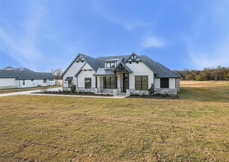 Stunning Bailee home situated on over 3 acres located in Coveted Las Brisas Subdivision. Get ready to be wowed by the quality craftsmanship, trim, designer colors and features. The gourmet kitchen offers a huge island, double ovens, large walk in pantry, custom cabinetry with soft close hinges. Huge living room with accent ceiling, focal point chandelier and fireplace with gorgeous tile accent and rich woodwork. Entertaining is easy with a large slider that spills out onto the expansive patio that has serene views and an outdoor fireplace. Primary bedroom has a tall  ceiling with crown molding and an amazing wet room for the ultimate spa like experience. Just a few more extras include the foam encapsulation, private well, no city taxes and unbelievable views of some of the best Texas sunsets and sunrises.