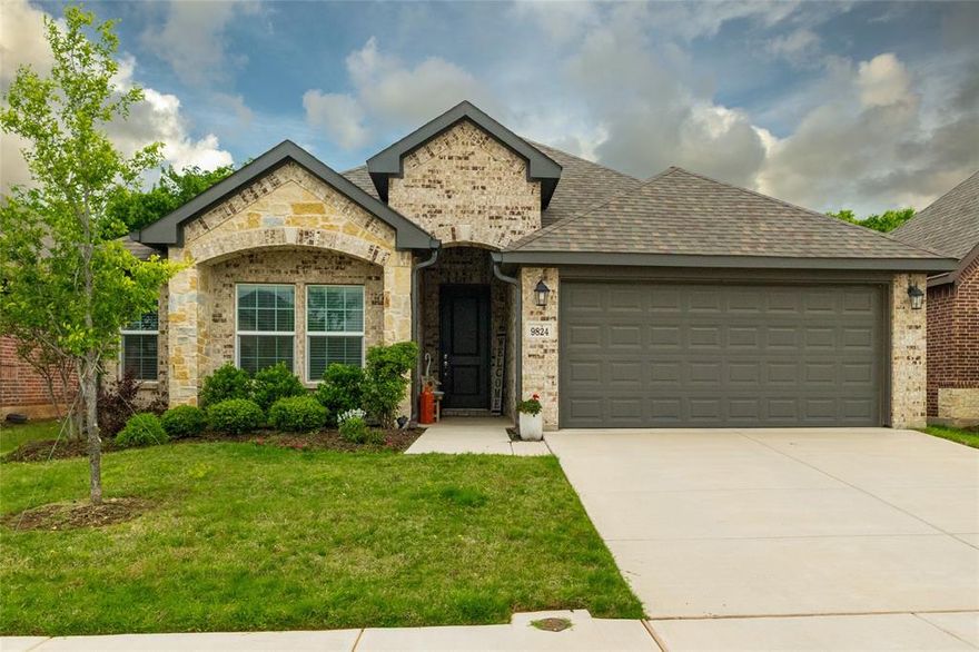 9824 Mescalbean Boulevard showcases one of the most sought-after floorplans in the subdivision—known for its functionality, flow, and everyday livability. This beautifully maintained 3-bedroom, 2-bath home offers a bright open-concept layout, perfect for modern living and entertaining. Natural light fills the spacious living area, seamlessly connecting to the dining space and well-appointed kitchen, creating an ideal setting for gatherings or quiet evenings at home. Designed with comfort and convenience in mind, the split-bedroom layout provides privacy, while the primary suite offers a relaxing retreat. Step outside to a large backyard with covered patio, perfect for outdoor entertaining, pets, or future enhancements—adding both lifestyle appeal and long-term value. Located just minutes from shopping, dining, and major highways, this home offers an easy commute and is approximately 10 minutes from Fort Worth, giving you quick access to top restaurants, entertainment, and cultural attractions. Nearby parks and green spaces further elevate the lifestyle, making this an ideal setting for buyers seeking both convenience and community.

A rare opportunity to own a highly desirable plan in a prime location—schedule your private showing today.