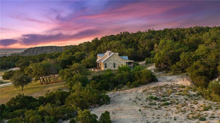 JUST LISTED — TURN-KEY RANCH WITHIN THE GORGEOUS HILLTOPS OF BOSQUE COUNTY |  From the minute you pull through the gate you will immediately feel the peaceful setting and premier recreational opportunities come alive! This ranch is maintained like a state park and every single inch of the land offers views in all directions.  From the hilltops to the hillside custom home and guest quarters you will never want to leave! 

TERRAIN: This ranch has been planned to utilize and every trail is seamlessly accessible and easily traveled.  There are many elevation changes that include 180 degree views and spectacular panoramic sunset watching opportunities.  One of the most impressive characteristics of this property is the amount of huge sprawling oak trees and the perfect amount of open-to-wooded ratio making this 123 acre ranch feel doubled in size. 

WATER: This property includes 3 great-sized ponds that have been significantly improved for longevity and to make sure they thrive for years to come.  Each tank has been sealed with soda ash and fed with new diversion terraces.  They have also been recently stocked and are ready to enjoy for decades to come.  There is also a creek that meanders through the property catching water from every direction.  The surface water found in so many places on this ranch offers endless chances to see various wildlife sitings anytime of the day.  

WILDLIFE: Embrace the endless allure of hunting and fishing, with the land providing a haven for whitetail deer, dove, turkey, and various other species, ensuring exhilarating adventures for outdoor enthusiasts.  The water accessibility as well as the tree cover make hunting a primary feature of this ranch. 

IMPROVEMENTS: This ranch features a stunning custom home that sits on the hillside overlooking some of the most amazing views of Bosque County.  The stone home also features a huge covered pavilion with top of the line Viking appliances as well as a 60” wood burning fireplace.  The i
