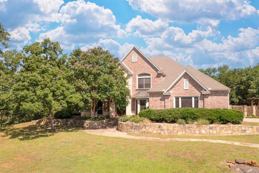 NEW ROOF INSTALLED OCTOBER 2025!    PRIVACY IS PRICELESS.   This stately home has upgrades and finishes which far exceed the asking price of the property.  This home has ALWAYS been meticulously cared for.  Are you ready to upgrade your lifestyle with space for friends and extended family?  Come grill, garden and entertain your way to HAPPINESS and RELAXATION.  Exceptional opportunity to own this lovely estate on a rolling hill with 3 acres and over 50 majestic trees. Take a stroll on your flagstone walkway to multiple outdoor private living areas.  3 gathering rooms and 2 large dining areas welcome friends and family.  Relish working from home in a lovely study with fireplace, builtins and gorgeous views.  20 foot ceilings welcome you to a huge open dining area just off the spacious kitchen with built in Sub Zero, ice maker, pantry, island and bar with seating.  Wind your way up the newly paved drive and enter from your oversized 3 car garage to mudroom with adjoining laundry  and powder room.   Take your lunch break on your stone patio with a view of tranquil wooded area with deer, turkey, etc.   This home is a remarkable value for the quality and rare setting it offers.  Very commuter friendly from either I35 or the Tollway.  Set aside an hour to take this lovely property all in.  Every home in Butterfield Junction is on acreage and traffic is extremely minimal.  Home is just across from Isle Du Bois State Park which offers paved walking trails, mountain biking trails, boat launches, beach and extensive wildlife.  Equestrian trails accessible in the neighborhood as well.