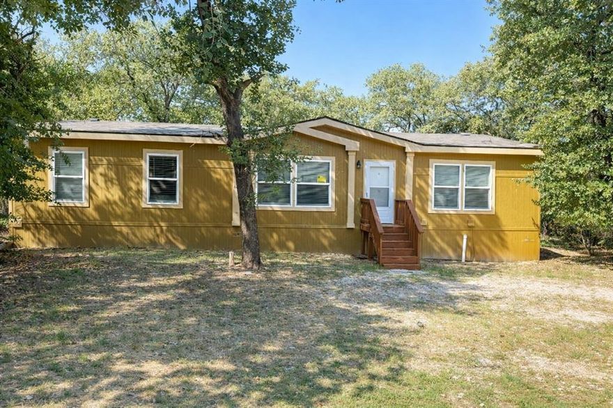 OWNER FINANCING!!! BAD CREDIT OK!!! Discover modern living in this beautifully refurbished 3-bedroom, 2-bath manufactured home, just a short distance from the serene shores of Eagle Mountain Lake. Boasting a fresh, updated interior, this spacious home features an open-concept living and dining area, ideal for both entertaining and everyday comfort.