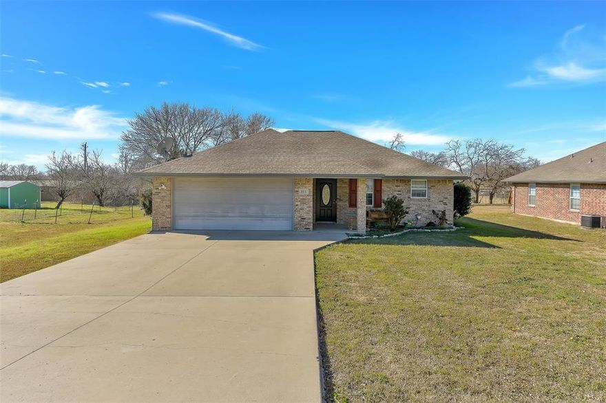 MOTIVATED SELLER ***Charming country living with city convenience! This well-maintained 3-bedroom, 2-bath home with a 2-car garage sits on a spacious half-acre lot, offering plenty of room to enjoy outdoor living. The property includes a tornado shelter, providing added peace of mind. Inside, you’ll find a functional layout with comfortable living spaces ideal for everyday living or entertaining. Enjoy the quiet, small-town atmosphere while still being conveniently located near the city, with easy access to nearby highways, shopping, dining, and schools. A great opportunity to enjoy space, safety, and accessibility all in one property.Don't delay come view today. Welcome home!