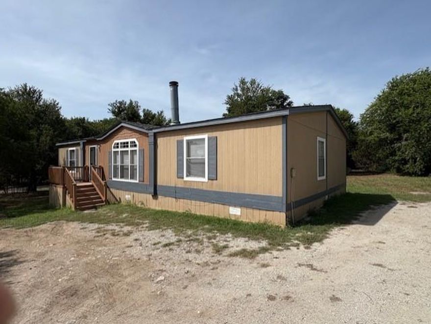 Fully Refurbished Home on 1 Acre – Move-In Ready with Room for All, Including Animals! This charming and updated home is ready to welcome its next family—pets and livestock included! Situated on a spacious one-acre lot in a peaceful area surrounded by well-kept houses, it offers the freedom and space you’ve been looking for. Step inside to discover a freshly refurbished interior, featuring new flooring, a brand-new stove, and a comprehensive list of thoughtful repairs already completed. You'll immediately notice the open and airy layout that greets you from the front door—perfect for both daily living and entertaining. Although this home will not qualify for FHA financing due to its having been moved several times, rest assured that its condition is solid and well-maintained. It’s move-in ready and waiting for your personal touch.
