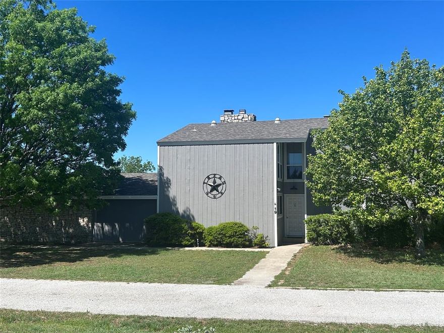 This two-story home with great curb appeal home is located in the well-established Chaparral Estates neighborhood that overlooks the charming community of Goldthwaite. The home sits on an expansive corner lot consisting of 1.82 acres with great tree cover and abundant wildlife. The centerpiece of the home is a large living room with a two-story vaulted ceiling, a two-story fireplace, built-in shelves, floor to ceiling windows that bring the outdoors in and sliding glass doors that open to two patios. The first floor also has a kitchen, large dining room, ensuite bedroom with a bathroom and walk-in closet, a guest bathroom, a sunroom that opens to a covered patio, a large utility room with a sink and refrigerator, a mechanical room and a two car garage also with floor to ceiling windows. Upstairs there is a bonus room with a rock fireplace and overlooks the living room, two additional bedrooms and a bathroom. Though the home is great for entertaining, you will spend time outside on the many outdoor patios entertaining and enjoying the wildlife. It is also important to mention the home has recent upgrades including new wood floors, a new master shower, and new vinyl windows in most rooms. All appliances convey including a refrigerator in kitchen and the washer, dryer and refrigerator in the utility room. Home has City water and electricity, gas, an aerobic septic and high speed Internet.