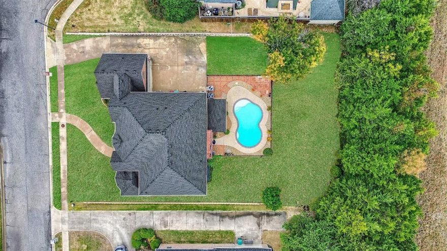 Luxury living awaits in this custom-built brick and stone home in a meticulously planned Community. With over 4,000 sq. ft., 5BA, and potential for 6BR, this residence features two fully-equipped kitchens with double appliances, a grand island for entertaining, two family rooms, two fireplaces, a game room, and a media room. Detailed molding adds sophistication throughout. Outside, enjoy a Covered Patio, Pool, and Spacious private lot. Conveniently located minutes from Lake Texoma and a short drive to McKinney and the Metro-Plex. This home seamlessly combines luxury, comfort, and convenience for the ultimate living experience.