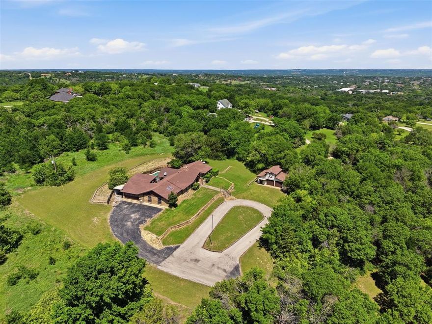 Nestled on 3 private acres in highly sought-after Aledo ISD, this 4-bedroom, 2.5-bath home offers a rare opportunity to create something truly special. With a gated entrance, long private driveway leading up to the home, fenced acreage, swimming pool, separate shop or garage, and endless charm, this property is full of character and potential. Inside, you’ll find a spacious split-bedroom floor plan, large game room, and a layout ready for your vision and updates. Surrounded by mature trees and offering exceptional privacy, the setting is just as impressive as the possibilities. The detached garage apartment will require renovation, but adds even more opportunity for those looking to restore and maximize the property’s full potential. Property is being sold as-is and is ideal for buyers looking for acreage, character, and the chance to transform a unique property into their own private retreat.