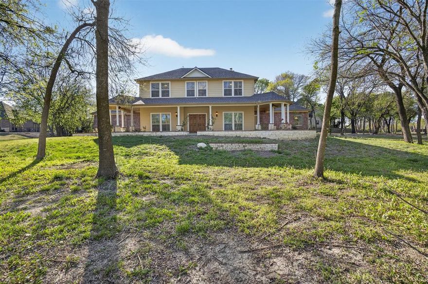 Nestled within the prestigious gated community of Waterstone Estates, this elegant residence sits on over an acre of land, offering rare space, privacy, and endless possibilities. Tucked away in a quiet cul-de-sac, the expansive lot provides plenty of room to create your dream outdoor oasis—whether it’s a pool, garden, shop, or simply wide-open space to relax and enjoy the peaceful surroundings. Inside, the home features beautiful hardwood floors, a spacious three-car garage, and a thoughtfully designed split-bedroom floor plan. A dedicated home office with a built-in desk makes working from home effortless, while oversized walk-in closets throughout offer exceptional storage. The primary suite serves as a private retreat, complete with a spa-like ensuite bath featuring a jetted tub, separate vanities and two generous walk-in closets. Upstairs, you’ll find two additional bedrooms and a full bath, offering ideal separation and flexibility. Step outside to a welcoming patio, perfect for entertaining guests of any size or enjoying quiet evenings under the Texas sky. Waterstone Estates is known for its scenic water views, rolling hills, and mature trees—creating a serene setting that feels like more than just a neighborhood… it’s a lifestyle.