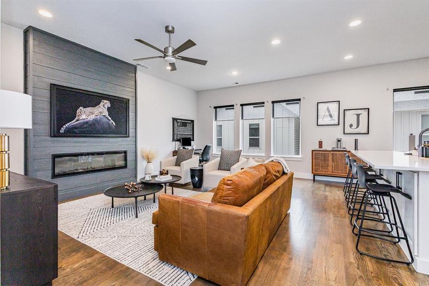 Step into this exquisite detached townhome, perfectly situated in a gated community with a low HOA, combining privacy, style, and comfort. Inside, you'll find gleaming hardwood floors, new carpet (2024), and a thoughtfully updated living area featuring a floor-to-ceiling accent wall with an electric fireplace, creating a cozy yet contemporary atmosphere. The open-concept kitchen is bathed in natural light and showcases sleek quartz countertops, ideal for cooking and entertaining. Each bedroom includes its own ensuite bathroom, offering convenience and privacy for every resident. Additional highlights include a tankless water heater for energy efficiency and a private green space, perfect for relaxation or letting pets roam. As a detached unit, this home qualifies for lower interest rates than typical attached properties, presenting an exceptional opportunity for buyers seeking value, privacy, and modern luxury. Refrigerator, washer, dryer, and furniture are negotiable.