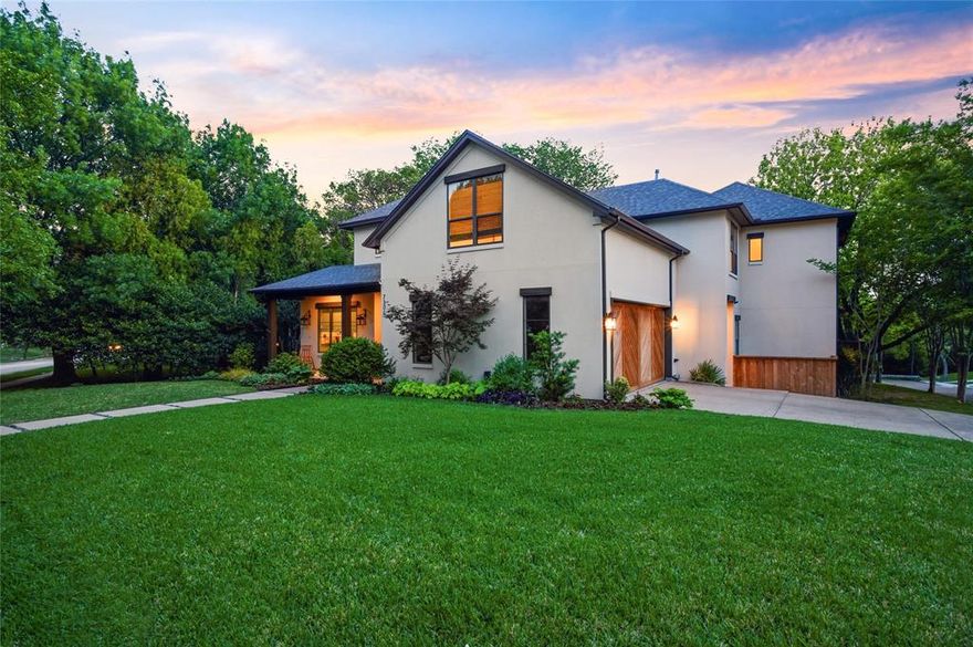 Set on a stunning corner lot in one of Lakewood’s most sought after pockets, this exceptional home blends modern luxury with thoughtful design in a premier location zoned to Lakewood Elementary. Just down the street from Lakewood Country Club, Dallas Arboretum, YMCA, Lindsley Park and the Santa Fe Trail, it offers the very best of Lakewood living. Designed for both effortless entertaining and everyday comfort, the home is bathed in natural light and anchored by a chef’s kitchen featuring an oversized island, custom cabinetry, built in refrigerator, and a professional grade range. The space flows seamlessly into a spacious living and dining areas, creating an ideal setting for intimate gatherings or large scale entertaining. The main living room in centered around a striking fireplace and framed by views of the beautiful back yard. Level 5 wall finishes, polished concrete and hardwood floors, and exceptional craftsmanship throughout create a refined, custom feel.  The primary suite is a true retreat with a spa like soaking tub, dual vanities, and steam shower. A thoughtfully designed, oversized custom primary closet connects directly to the laundry room for ultimate convenience. At the front of the home, a private study provides a refined and quiet work-from-home environment. Upstairs, three additional bedrooms are complemented by a spacious game room, built in study area, a light filled workout fitness room, generous walk in closets, and two walk in attics that provide abundant storage.  Outdoor living is equally impressive, featuring a covered patio, built in grill, fire pit, and a rare oversized turfed backyard an ideal setting for entertaining, relaxing, or play. Sophisticated, functional, and beautifully executed, this residence represents a rare opportunity to own a truly exceptional home in one of Lakewood’s most desirable settings.