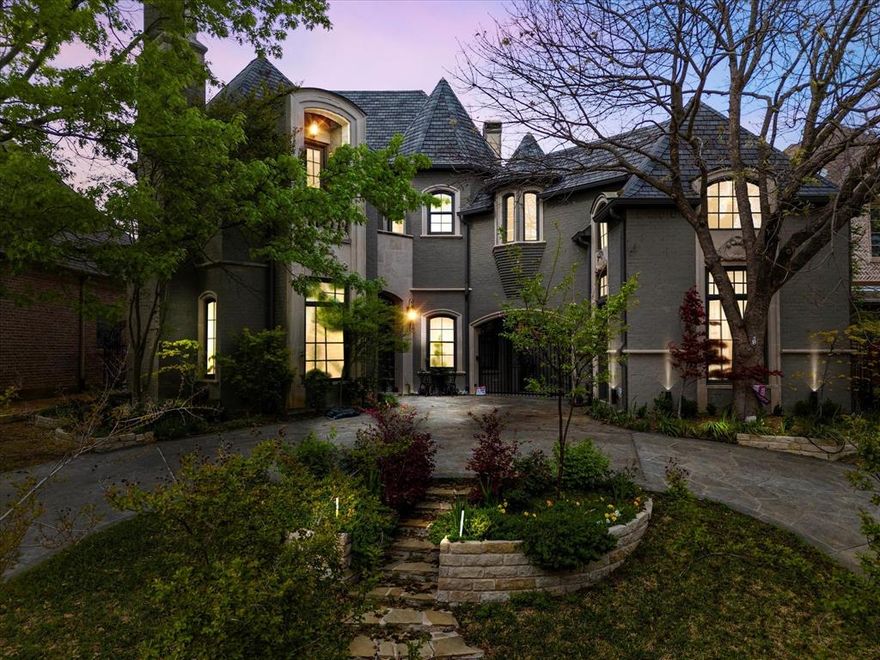 Step into a world of timeless elegance and unparalleled luxury with this breathtaking castle-inspired home, nestled right in the heart of Dallas just steps from the highly sought after Lakewood Elementary School. Boasting architectural grandeur and modern comforts, this magnificent residence offers an extraordinary living experience for those who appreciate refined sophistication! As you enter, you're greeted by hand scraped hardwood floors throughout the home, scalloped ceilings and exquisite craftsmanship. The gourmet kitchen, equipped with Viking appliances and Soapstone countertops, seamlessly blends classic charm with modern convenience. Step outside to your private outdoor oasis, where new stonework enhances the luxurious pool, inviting outdoor kitchen, and spacious entertaining area—perfect for hosting gatherings or relaxing under the stars. If one outdoor space wasn't enough, the enchanting courtyard provides a serene sanctuary perfect for gardening and hosting outdoor soirées. Wine enthusiasts will delight in the meticulously designed wine cellar, perfect for showcasing and preserving your finest vintages. Whether hosting a private tasting or simply unwinding with a favorite bottle, this space is a true connoisseur’s dream. Upstairs you will find three generously sized bedrooms, each thoughtfully designed with its own luxurious ensuite bath, ensuring comfort and privacy for family and guests alike. The primary suite is a true sanctuary, offering a spa-inspired bath and a spacious walk-in closet! Additional features include an office, formal dining room, a secondary media space, and an added touch of luxury awaits in the private guest suite with a private entrance adding to the home’s luxurious appeal. Located just minutes from premier dining, shopping, this home offers the rare combination of opulent living and unbeatable urban convenience.