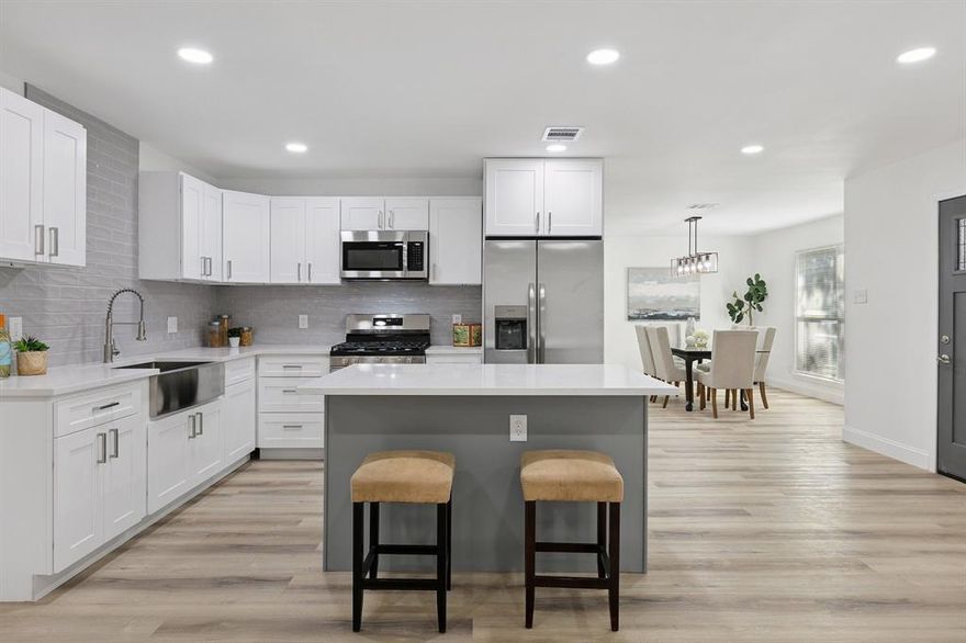 Welcome to this beautifully renovated 4-bedroom, 2.5-bath home offering 2,076 square feet of thoughtfully designed living space. From the moment you arrive, you’ll be greeted by fresh sod in the front yard, new landscaping, and colorful flower beds that create incredible curb appeal. Step through the brand-new front door into a bright and airy open-concept layout filled with natural light and modern elegance. At the heart of the home, the stunning kitchen features crisp white shaker cabinets, gleaming quartz countertops, a stylish gray tile backsplash, and a full Frigidaire stainless steel appliance package. The open layout makes it easy to cook, connect, and entertain—all in one inviting space. Just off the kitchen, the spacious living area centers around a charming fireplace and flows seamlessly into the dining area—ideal for gatherings of any size. Every detail has been thoughtfully updated for comfort and peace of mind, including a brand-new roof, luxury vinyl plank flooring throughout, a new Trane HVAC system with all-new ductwork, brand-new windows, a new electrical panel, and a newly installed sewer line that runs all the way to the city connection. Retreat to the serene primary suite, where you'll find a spa-like ensuite bathroom complete with a sleek double vanity and a luxurious walk-in shower with dual shower heads. Three additional bedrooms offer plenty of space for family, guests, or a home office. Step outside to enjoy the privacy of a newly fenced backyard—perfect for relaxing or entertaining in your own private oasis. With its fresh finishes, smart updates, and warm, welcoming style, this move-in ready home is a rare find. Don’t miss your chance to own this exceptional property—schedule your showing today!