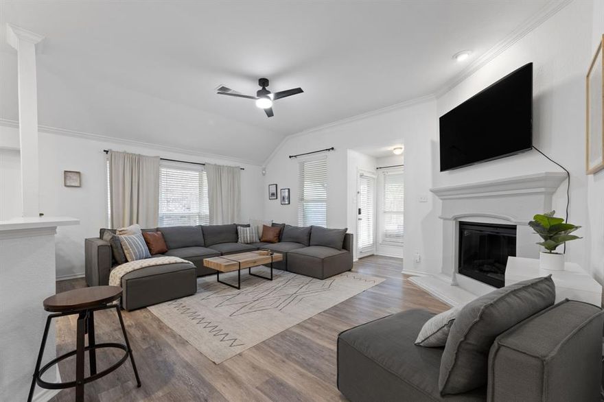 Exactly in the middle of all of DFW, this beautiful home offers unbeatable convenience. 20 minutes to Downtown Dallas. 20 minutes to Downtown Fort Worth. 15 minutes to DFW Airport. 5 minutes to the Arlington Entertainment District and Downtown Arlington. Perfect for commuters or anyone who loves being close to everything DFW has to offer.

Inside, the thoughtfully designed open-concept layout offers a seamless, elegant flow. The kitchen overlooks the entire living room, making it ideal for entertaining and everyday gathering. The home features thick white quartz countertops in the kitchen and bathrooms, elegant gold faucets and hardware, modern light fixtures, crown molding throughout, and neutral tones that keep the space bright and timeless.

The oversized master bedroom offers exceptional comfort with abundant natural light, a spacious walk-in closet, double vanity, and a relaxing garden tub. 

Enjoy outdoor living on the charming front porch or the covered back patio, perfect for grilling, entertaining, or unwinding. The backyard is generously sized and great for spending time with friends and family.

A light-filled flex room with double glass doors offers the ideal space for a formal dining area, a home office, or creative workspace.

This is truly a beautifully cared-for home in the heart of DFW.