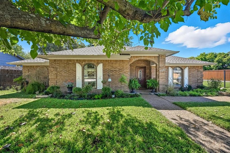 This well-loved home blends charm with thoughtful updates, offering a functional layout perfect for everyday living.No HOA! Oversized Lot! 3 Fenced yards. Spacious 3-bed home + 2 living areas (easily converted to a 4th bedroom).The primary suite boasts hand-scraped water-resistant laminate, and an updated ensuite bath features a stylish blocked glass design for natural light, with a soaking tub, a separate shower, upgraded fixtures, tile floors, ceiling fan & dedicated water heater--pure comfort! Secondary bedrooms have walk-in closets & ceiling fans. The main living area offers a wood picture-frame molding accent wall, stained concrete floors, a fireplace that brings the warmth and ambiance of a retreat, & dual ceiling fans. A second fireplace is in the additional living space. The dining room features elegant French doors, adding character & versatility to the space. The kitchen features a skylight, ample cabinetry, a large island, and a spacious breakfast room with many windows overlooking the backyard, a ceiling fan, and a unique round ceiling that adds character. The utility room includes cabinet space, a storage closet, and access to the mudroom. Welcoming mahogany door with leaded glass opens to a charming entry and pebble stone walkway, ready for your personal touch! Recent Upgrades: 2024 Roof (30-year shingles), fresh exterior paint, gutters, stained cedar fence, black iron front fence with large entry gates, extended concrete driveway, swing garage, sprinkler system, floodlights & Ring doorbell. Backyard Dream is great for entertainment. Mature landscaping, oversized covered patio & secure 8-ft fenced storage—ideal for boats, work trucks, trailers, or a hobby shop! Prime Location: Near the fire station & walk to downtown, parks—including a dedicated dog park for your furry friends. Enjoy quick access to DART Rail, I90 Turnpike, I-30, and 635, making commuting a breeze! Close to shops & dining or easy travel routes for work, this home delivers it all.