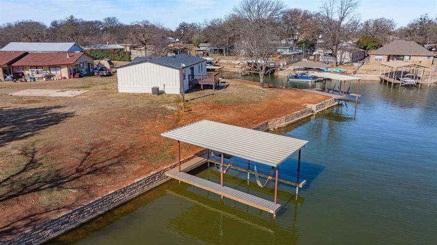 107’ of waterfront with a brand-new boat dock and retaining wall — this is one of those hard-to-find Granbury lake lots. Located at 4506 E Kenwood Ct, tucked at the end of a quiet cul-de-sac, you get privacy without feeling isolated. The dock sits just off the main body of the lake, making it an ideal spot for fishing, boating, or simply enjoying the water.
Whether you’re looking to build a lake home or keep a boat on the water for weekend getaways, this property gives you flexibility and room to make it your own. Opportunities like this don’t come up often on Granbury — solid waterfront with a lot of potential.
