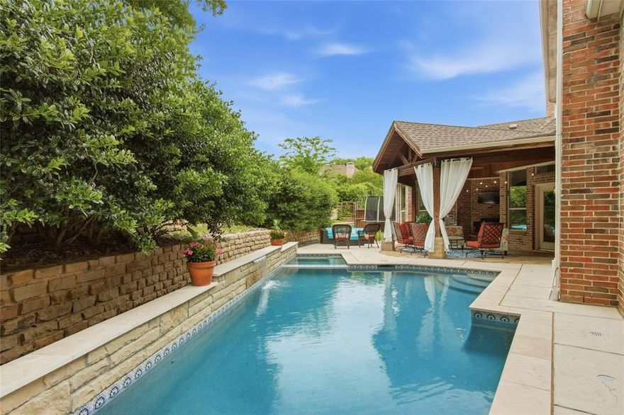 A standout in one of McKinney’s most sought-after communities, this beautifully updated home sits on a .24-acre lot in Meadow Ridge of Stonebridge Ranch and delivers the kind of presence you’re looking for right now. With 5 bedrooms and 4 bathrooms, you’ll appreciate the flexible layout, including the fifth bedroom with built-in desk and bookcases—perfect for a true home office or study.Your downstairs primary suite offers a private retreat, overlooking the backyard and pool, with a spa-like bathroom featuring a dramatic freestanding tub, separate shower, split vanities, and a generously sized closet.

Upstairs, you’ll find 3 bedrooms with ensuite baths as well as a massive game room with space to spread out. While the first floor is filled with natural light from recently installed windows that overlook the backyard, just step outside and you’ll see where this home truly stands apart—a custom pool plus spa and outdoor living area completed in November 2024 by Foley Pools, with over $120,000 invested to create your own private, resort-style retreat. Inside, brand-new hardwood floors, extensive fresh paint, and thoughtfully updated kitchen finishes give you a clean, elevated feel throughout. This is the one you’ve been waiting for!!