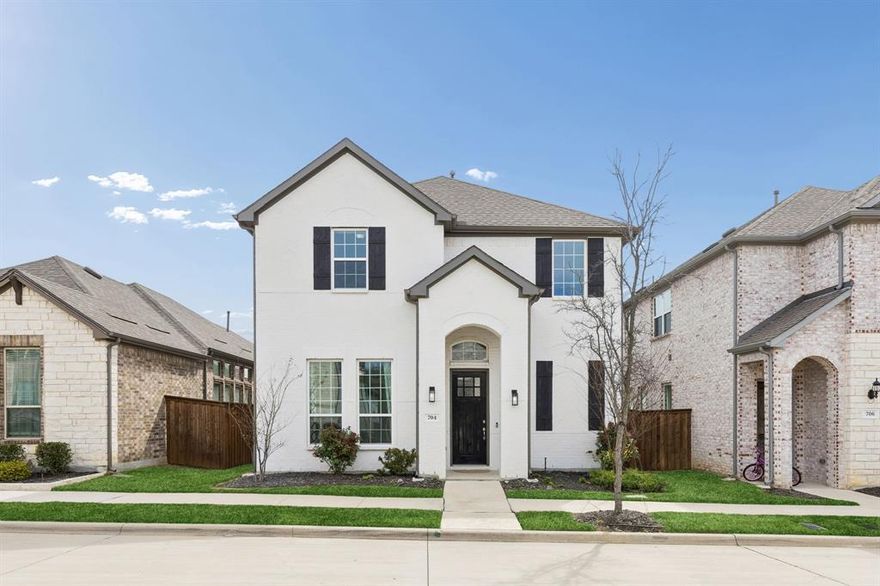 Welcome to 704 Waterbrook Parkway in Argyle, Texas, a beautifully designed newer construction home built in 2022 by Gehan Homes and based on the sought-after Orwell 240G floor plan. Offering approximately 2,432 square feet of thoughtfully planned living space, this residence features four bedrooms and two and a half bathrooms, delivering a flexible layout suited for modern living and entertaining. The home immediately stands out with its painted white brick exterior, gray trim accents, and clean architectural lines that create strong curb appeal. Inside, the dramatic two-story family room serves as the centerpiece of the home, enhanced by open railing details and extra windows that invite abundant natural light and create an airy atmosphere. The open-concept layout allows the main living areas to flow seamlessly, providing a comfortable setting for daily living or gatherings. Interior upgrades totaling $45,701 enhance both style and functionality throughout the home. The kitchen connects naturally to the living and dining areas, creating excellent visibility and flow while maintaining a polished, contemporary design that buyers often search for in newer Argyle homes. Located within the Waterbrook community, residents enjoy scenic green spaces, walking trails, neighborhood ponds, and park areas that contribute to a peaceful setting. The neighborhood offers convenient access to major commuting routes while maintaining the quiet character that makes Argyle highly desirable. Argyle is widely recognized for highly rated Argyle ISD schools, small-town charm, and convenient proximity to the Dallas–Fort Worth metro area. Combining modern construction, interior upgrades, and a location within one of Denton County’s most sought-after communities, 704 Waterbrook Parkway presents an excellent opportunity in today’s North Texas real estate market.
