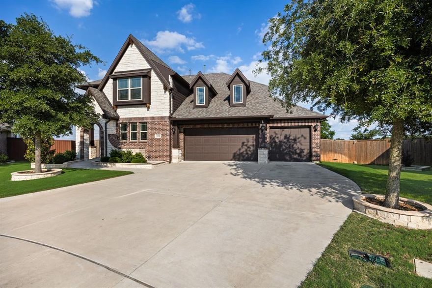 Tucked away in a cul de sac on a premium lot with a pool and views. The new luxury vinyl plank floors run throughout the home and give it that clean, updated feel.  The kitchen opens up right into the living space with a huge island, pot filler and plenty of room to entertain.  The oversized living room features a beautiful stone fireplace and large windows overlooking the backyard.  Theres also a dedicated office, oversized laundry room, and one of the coolest details.. a built in doggy house tucked under the stairs.  The natural light, tall ceilings, and open spaces make the whole home feel warm and inviting.  The 3 car garage gives you the flexibility for storage, a gym setup, workshop space or all three. From the warm finishes to the functional layout, every part of this home was thoughtfully designed and its even better in person.