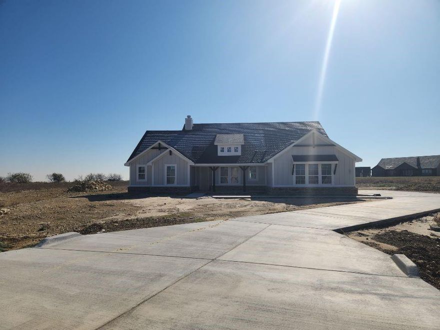 Estimated December completion! Ask us about our Trade In Trade Up program, we can buy your home! The 4-bedroom Colorado 2 offers a thoughtful 2,426 sq. ft. layout. From the entrance, you see the entire main living area, an open concept perfect for entertaining. The kitchen features a large center island with seating for four and a view of the family room fireplace. A formal dining room near the kitchen is ideal for special occasions or can be a playroom or living room. Across the foyer, a flex room can become a fifth bedroom. The owner's suite, located at the back under a tray ceiling, includes a bathroom with a soaking tub, step-in shower, dual vanities, and a private water closet, plus a spacious walk-in closet with wooden shelves. The three secondary bedrooms, two with walk-in closets, are in a suite-like area and share a second full bath. The Colorado 2 strikes a perfect balance between togetherness and privacy. This home will be zoned for Dixie Hansel Elementary which is currently under construction.