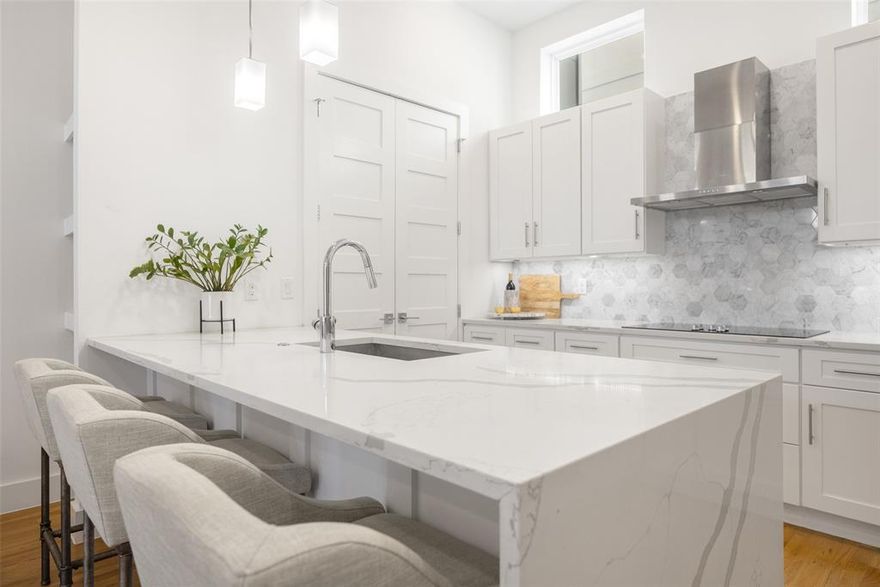 Price Decrease & Offering Seller Concessions! Tucked in a vibrant, central Dallas location, this stylish townhome-style condo lives more like a single-family home thanks to its rare private fenced yard, a true urban luxury. Designed for those who value both indoor-outdoor living and walkability, this home offers an exceptional blend of privacy, space, and sophistication. The first level features a flexible bonus room ideal for a home office, gym, or creative studio, with direct access to your own fenced green space, perfect for pets, outdoor lounging, or morning coffee. An attached two-car garage adds convenience and security. Upstairs, soaring ceilings, abundant natural light, and rich wood floors create a bright, open atmosphere ideal for entertaining. The seamless flow from living and dining to the chef’s kitchen and spacious balcony makes hosting effortless. The kitchen impresses with quartz countertops, a marble backsplash, premium appliances, and a large island designed for gathering. The third floor offers a peaceful retreat with two spacious bedrooms with wood floors and each with an en suite bath. The primary suite boasts a spa-like oversized shower and a generous walk-in closet, while an upstairs laundry room adds everyday ease. Located less than a mile from Baylor Medical Center and just minutes from Downtown, Uptown, and Lower Greenville, you’ll enjoy the best of Dallas dining, nightlife, and culture — all while coming home to your own private oasis in a low-maintenance, lock-and-leave setting.