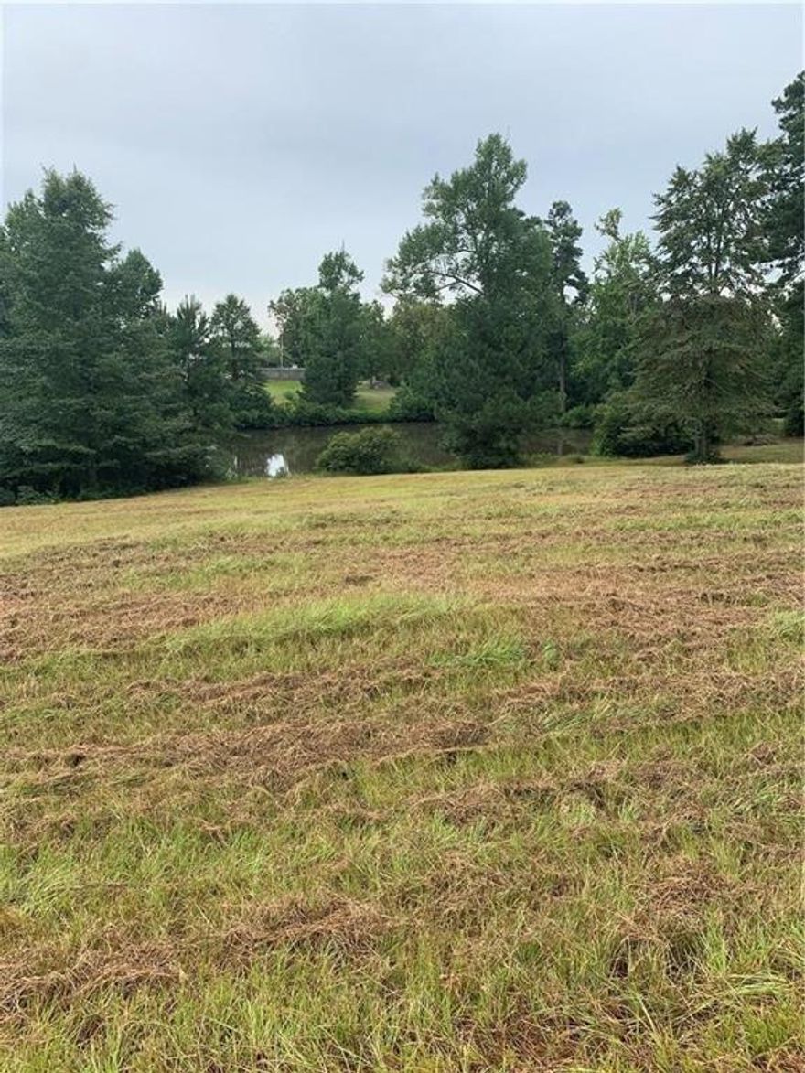 Build your dream home here! Seller willing to help with dirt work with acceptable offer! Stately homes and mature trees line the street.  Pride of ownership is evident as you make your way down Garrison Trail.  This is truly one of the most beautiful areas in Minden!  Small pond!  Building restrictions:  Residence must have 30'set back from the street, 30' set back from the back property line and 10' set back on each side.