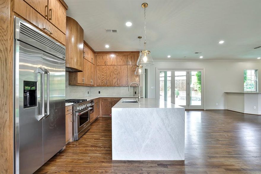 Fully remodeled in 2026, this exceptional home is located in the prestigious 24-hour guarded and gated golf course community of Mira Vista, offering stunning views of the 9th fairway and showcasing extraordinary craftsmanship with bespoke designer finishes throughout. A grand oversized circular driveway leads to an impressive decorative wooden entry, opening to interiors featuring plantation shutters, freshly stained wood floors, new designer lighting, and fresh paint. The home offers two spacious living areas and a formal dining room with built-ins and a serving area, flowing into a completely redesigned kitchen with high-end finishes, ample cabinetry, and a newly added butler’s pantry. The primary suite is a luxurious retreat with a remodeled fireplace and a spa-inspired bathroom featuring a freestanding soaking tub, oversized shower with body sprayers, and a fully redesigned custom closet. Upstairs, three additional bedrooms and three full bathrooms have been thoughtfully updated. Additional highlights include a large mudroom with abundant storage, an epoxy-coated garage, with a porte-cochère behind an electronic gate. The outdoor space is an entertainer’s dream, featuring an oversized patio with a gas fire pit and built-in speakers, overlooking a newly remodeled pool and spa, a low-maintenance turfed yard, and sweeping golf course views creating a true resort-style living experience.