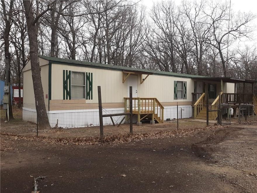 Cute and Clean mobile in Red Hawk Bay. Nice open floor plan with a big kitchen that opens to the living room. 3 bedroom 2 baths. Laundry area for washer and dryer. Includes refrigerator. Big front deck sits on approximately a half acre. Room to park an RV or boat. Just move right in and make this home!