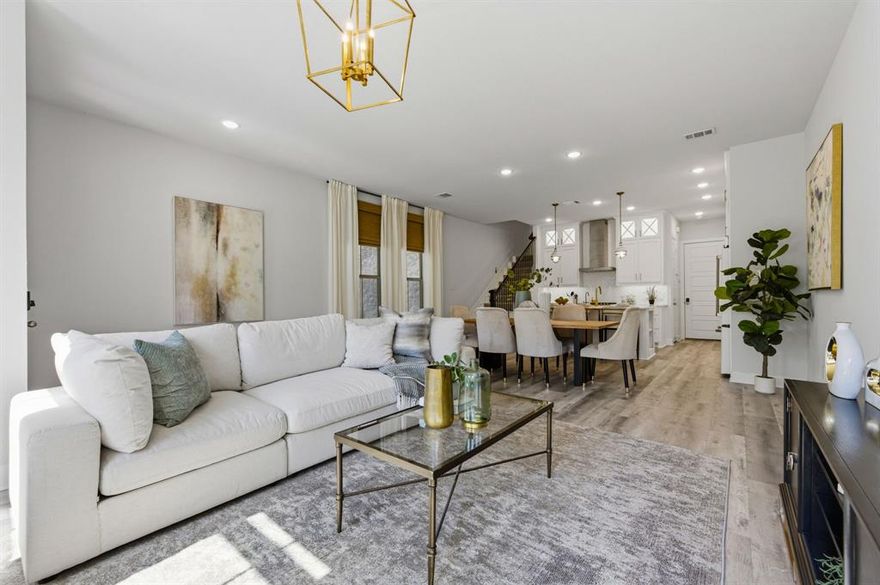 Experience refined luxury living in this exceptional 3-bedroom, 3.5-bath single-family residence in the highly sought-after Oak Park community. From the moment you enter, you’re greeted by soaring ceilings and an expansive open-concept living space that flows effortlessly into the dining area and gourmet kitchen. Every detail has been curated to impress — including a sophisticated Café white refrigerator with bronze accents, striking dolomite countertops, custom white shaker cabinetry, herringbone backsplash, and water filtration faucet. The second-floor primary suite is a serene retreat, offering a spacious walk-in closet and a spa-inspired en suite bath with dual vanities, a luxurious soaking tub, and a separate glass-enclosed shower. A versatile landing area provides the perfect nook for a stylish workspace or reading lounge. A secondary bedroom with its own en suite bath and walk-in closet completes this level. Ascend to the third floor to discover a breathtaking flexible living space—ideal as a media room, fitness studio, or executive home office—seamlessly connecting to an expansive covered terrace. This outdoor sanctuary includes a gas hookup, creating an elegant setting for al fresco dining and entertaining. A third private bedroom with a full bath is also located on this floor. Premium upgrades include an epoxy-finished two-car garage, whole-home water filtration system, whole-home surge protection, and EV charger readiness. The private, fenced front yard features low-maintenance turf and a sleek concrete patio, perfect for morning coffee or evening unwinding. Residents enjoy access to resort-style amenities, including a sparkling community pool and two dog parks—all for a remarkably low $100-month HOA. Ideally positioned just steps from West Highland Park and minutes from the Dallas North Tollway, Medical District, Downtown, and Turtle Creek, this home offers unparalleled style, comfort, and convenience.