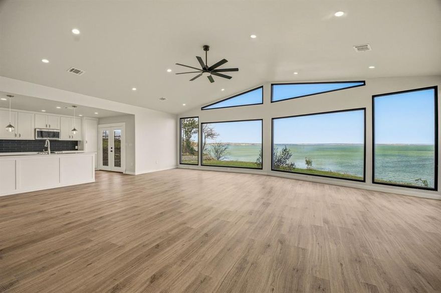 'CRYSTAL BLUE PERSUASION' will overtake you as you open the front doors of this Eagle Mountain Lake home, which produces the greatest view of the lake of any home on the lake. Enjoy watching the birds and possibly an occasional eagle 'LEARNING TO FLY'. Your head will 'TURN, TURN, TURN' as you drink in all the activity on the water below you, including a full view of the famous Fort Worth Boat Club and all its 'SAILING' races. The 'BLUE SKY' and 'NORTHERN SKY' will guarantee you be 'FEELIN ALRIGHT' as you 'LISTEN TO THE MUSIC' at this 'EAGLE rocky MOUNTAIN HIGH' perspective. FYI -John Denver wrote some of his first songs around the corner on the water as he went to a local high school. This property is 2,250,000 and includes 2 separate lots (totaling almost 0.6 acres). The brand new remodeled home is over 1,500 square feet with 2 beds and 2 baths. 1,500,000 for the house and 750,000 for the vacant lot (what a view it has). Can be bought together or separately. The home can't be seen from the main road, so don't become in a 'CAN'T FIND MY WAY HOME' status! There is room for a 'SECRET GARDEN', 'FOR WHAT IT'S WORTH', and when the moon is out, plenty of space for a 'MOONDANCE'. As you gaze 'INTO THE MYSTIC', there will be 'CONVERSATION' about 'AIN'T WASTING TIME NO MORE' for a 'PEACEFUL EASY FEELING' (the EAGLES spent several weeks on this lake many years ago) while you become 'COMFORTABLY NUMB'. So enjoy and 'DON'T STOP BELIEVING' this could be yours!! Dare I say 'The sun pours in like butterscotch and sticks to all your senses' -JM. Home entrance is a private entrance. Do not access the property without consent from the Seller.