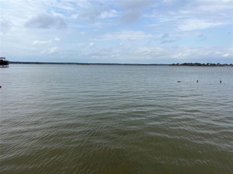 Land of Opportunity on sought-after Cedar Creek Lake! Rare chance to own 2 waterfront lots with approximately 101’ of platted shoreline in the heart of Gun Barrel City offering HUGE open water views and unforgettable sunset evenings. Tear down and create your dream lakefront retreat with room to spread out, or rejuvenate the existing home and add guest quarters for the ultimate family compound or weekend getaway.

The property offers an incredible street-to-water setting with a long paved driveway leading through mature trees to the waterfront. The design-friendly lot shape and depth provide endless possibilities for a custom build, outdoor entertaining spaces, pool, additional structures, or expansive lakeside living. Enjoy a great protected bay location with sweeping western-facing views across the main body of the lake.

Existing improvements include an old house,- some say tear it down, detached storage shed, fenced areas, and waterfront yard ready for your vision. Whether you are looking for an investment opportunity, redevelopment project, or your own private lakefront escape, this is a rare opportunity to create something special on Cedar Creek Lake.