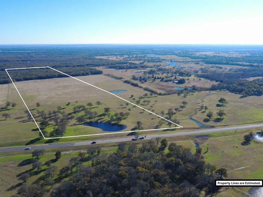 Just over 55 acres approximately, located just west of Corsicana, immediately outside the city limits on the HWY 31 Loop Bypass. Offering an excellent development opportunity. This tract offers approximately 760 feet of road frontage on the HWY 31 LOOP.  It can be sold with additional available adjoining acreage as well.  Positioned at the highly trafficked SH 31 Corsicana Bypass, this property benefits from exceptional exposure in a rapidly growing, high-traffic area. With tremendous potential for future development, this tract is ideal for investors or those looking to capitalize on expanding infrastructure. More acreage available MLS # 21134183, 21134270, 21134262, 21134269. Property will have deed restrictions including no dumping, junkyards, hog farms, or manufactured homes. ACCESS, UTILITY AVAILABILITY AND COST SHOULD BE VERIFIED BY BUYER. EXACT ACREAGE AND ROAD FRONTAGE TO BE VERIFIED BY SURVEY, MLS LISTING STATES ESTIMATED SIZE.