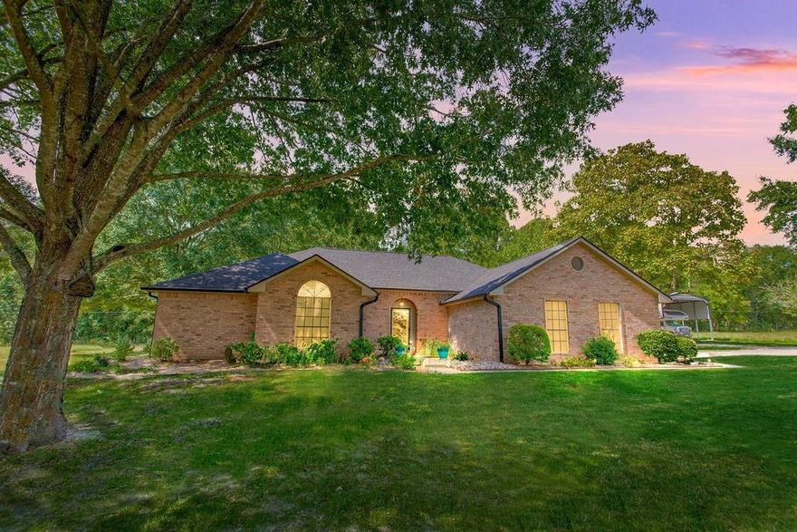 **Charming Country Retreat on 5.26 Acres** Welcome to your peaceful haven on 5.26 acres, perfectly situated on a country road that offers easy access to Interstate 20 and downtown Lindale, Texas. This custom-built beauty features three spacious bedrooms and 2.5 baths, providing ample room for family and friends. As you enter, you’ll be greeted by a generous living room, highlighted by an exquisite old wood-burning fireplace that radiates warmth throughout the home. Then as you step into the heart of the home—the open kitchen—where culinary creativity comes alive. With ample space for cooking and entertaining, it’s the perfect spot to prepare your favorite recipes and share meals with loved ones and friends. Adjacent to the kitchen space, you’ll find a large walk-in laundry room conveniently located off the two-car garage, making daily tasks a breeze. The backyard is your personal oasis, adorned with gorgeous flowers and lush trees that provide a tranquil, shaded escape. Imagine spending leisurely afternoons on the expansive covered porch, watching hummingbirds flit about and listening to the soothing sounds of nature. For those with adventurous spirits, there’s dedicated RV parking sufficient for a 30x30 vehicle, making it easy to embark on weekend getaways. The versatile man cave offers endless possibilities, whether you envision it as a workout space filled with your favorite exercise equipment, a cozy guest room for the guests, or a charming craft room to unleash your creativity. Spanning approximately 2,000 square feet, this beautifully designed home embraces you with comfort and style. Start each day by sipping your morning coffee while watching the sun rise over your property, painting the sky in a breathtaking array of pinks, reds, and blues—a daily reminder of the beauty that surrounds you, your beautiful home and the 5.26 acres that it sits on. Embrace country living with convenience, charm, and endless possibilities at this exquisite home.