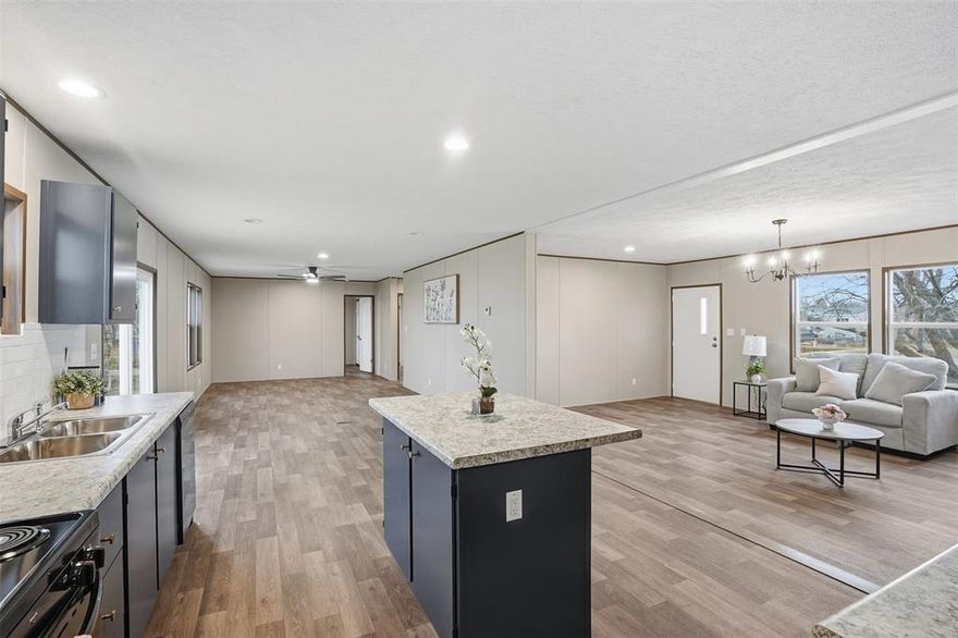 Buyers are welcome to view the lot now. The brand new manufactured home has been delivered and is on site, but is not quite ready for interior tours just yet. In the meantime, you are welcome to walk the property and view the beautiful lot and surroundings while the decks are being completed. The home is expected to be ready for interior walkthroughs within the next couple of weeks. This 4-bedroom, 2-bath home on a premium one-acre lot in Grandview with no HOA, surrounded by mature trees and set in a private wooded setting that offers exceptional privacy. Located outside the city limits with low county taxes, this newly constructed home comes backed by a manufacturer warranty for a worry-free start to homeownership. This large, open-concept home features painted cabinetry with updated hardware, tile backsplash, a glass shower door, and upgraded lighting and ceiling fans throughout. Outdoor features will include finished new front and rear decks, a new septic system, and all new appliances included. The acre lot provides excellent privacy and usable space, with plenty of room for a future shop, RV, trailer, or additional parking. FHA and VA eligible with low down payment options available. Please note, all interior photos are representative of the same model, actual interior photos will be uploaded once home is ready. License #MHDRET00038390.