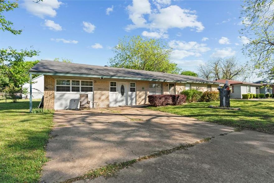 Charming 3-bedroom, 2-bath home with great space and functionality! The original garage has been enclosed to create a large family room, while a detached 2-car garage with rear alley access provides ample parking and storage. The kitchen includes a refrigerator, gas range, microwave, elevated dishwasher, and a movable island with seating for two and extra storage. Open concept layout with the original living area serving as a dinette space flowing into the kitchen. Carpet throughout with LVP flooring and tile in the bathrooms. Ceiling fans in every room. Spacious primary suite accommodates a king bed and features an ensuite with step-in shower. Secondary bedrooms fit queen beds comfortably. Main bath offers a tub-shower combo and extra cabinetry. Large grassy backyard with chain-link fence and storage shed. Plenty of storage throughout!