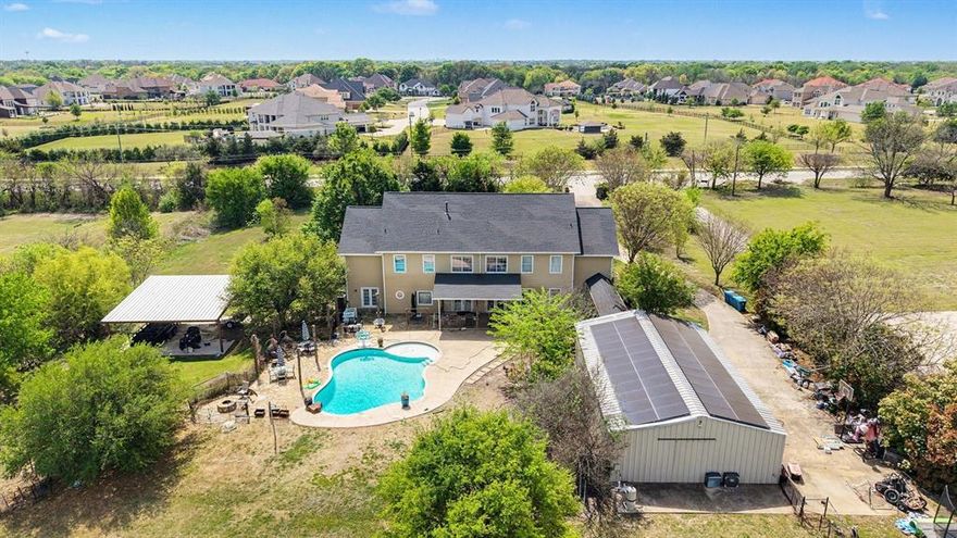 Instant equity awaits with this incredible Fairview estate recently appraised at  $1.45M+.   Experience the perfect blend of privacy, space, and functionality at 1751 Stacy Road, a custom-built home nestled on 2.3 sprawling acres within the prestigious Lovejoy ISD. With no HOA restrictions, this property offers rare flexibility in one of North Texas’ most desirable communities. Spanning over 5,300 square feet, the residence features 8 bedrooms and 4.5 bathrooms, thoughtfully designed for multigenerational living or grand-scale entertaining. The interior boasts grand vaulted ceilings, multiple staircases, dual laundry rooms, and energy-efficient solar panels. A standout feature is the massive 30x60 detached metal building equipped with electricity and plumbing, ideal for a workshop or collector’s garage. Located just minutes from Fairview Town Center and The Village at Allen, you will enjoy premier dining at Gloria’s or Wild Salsa and easy access to the Heard Museum. Excellent proximity to US-75 and SH-121 ensures a seamless commute to the city center while maintaining a quiet, secluded lifestyle.