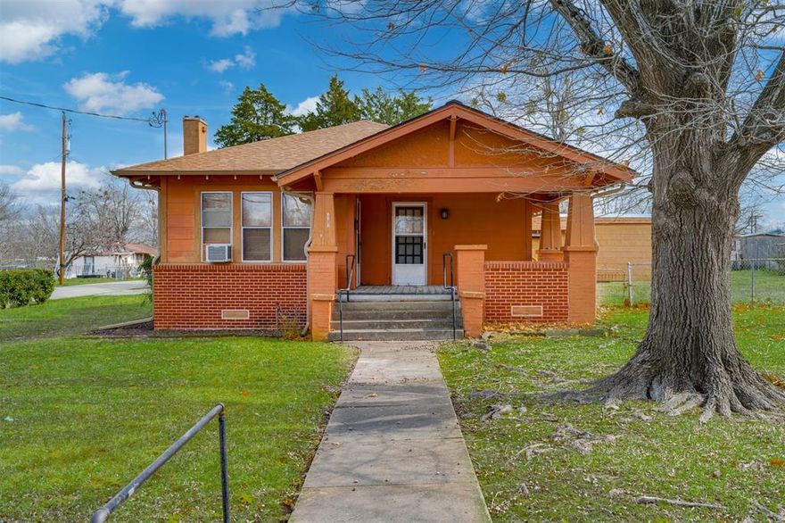 Step into timeless character and small-town charm with this beautifully preserved historic home in the heart of Clarksville, Texas. Situated on a prominent corner lot in a highly desirable area, this property blends original architectural details with everyday functionality.

From the inviting covered porches to the classic combination of brick and wood siding, the exterior immediately reflects its enduring appeal. Inside, you’ll find the warmth and charm of years past complemented by a flexible floorplan that easily adapts to your needs — whether you envision multiple living areas, a home office, formal dining, or additional guest space.

An attached carport provides convenient covered parking, while the fenced yard offers privacy and room to garden, entertain, or simply enjoy quiet afternoons outdoors. A dedicated storage room adds valuable space for tools, seasonal décor, or hobby equipment.

Homes with this kind of character, corner-lot presence, and location rarely become available. If you appreciate historic charm paired with versatility and practicality, this Clarksville gem is one you won’t want to miss.