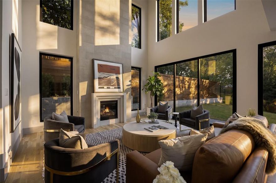 Tucked into a private creek lot on coveted Santa Barbara Drive, this newly constructed residence introduces a design driven approach to Lakewood living. The home blends modern architecture with refined materials and functional living spaces.
Set on a secluded .357 acre lot near White Rock Lake and Lakewood Elementary School, the residence offers five bedrooms and a layout centered around light and seamless flow. Expansive walls of glass and three oversized sliding door systems create an airy openness throughout the main living areas, while white oak hardwood floors, steel entry and balcony doors, and soundproofed windows reinforce the home’s elevated craftsmanship. Newly completed landscaping enhancements further elevate the property’s connection to its natural surroundings.
The great room is anchored by a soaring limestone fireplace and connects effortlessly to the kitchen and dining spaces, creating a natural setting for entertaining. The kitchen pairs sculptural design with everyday functionality, featuring Taj Mahal quartzite surfaces, a statement island, integrated appliances, and a butler’s pantry discreetly positioned behind the main kitchen.
The dining area was designed with hospitality in mind, complete with dual wine coolers and built in wine storage. Upstairs, two balconies extend from the living spaces, while a secondary lounge suite includes its own beverage station and private outdoor access. The primary suite serves as a quiet retreat with warm layered finishes and a calming atmosphere.
Additional features include integrated security and exterior camera systems, designer lighting, millwork, and curated material selections throughout. Approved pool permits from the City of Dallas are also in place, allowing the future owner to seamlessly incorporate a resort style outdoor environment into the property. The result is a residence that feels architectural yet livable, balancing modern design with comfort and functionality in the heart of Lakewood.