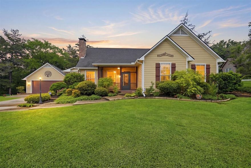 Welcome to this beautifully maintained 3-bedroom, 3-bathroom home where comfort, character, and functionality come together seamlessly. Freshly painted throughout, the interior feels crisp and inviting, highlighted by soaring vaulted ceilings in the living room and a striking fireplace that serves as the heart of the home. The open-concept layout creates an effortless flow between living, dining, and kitchen spaces—perfect for both everyday living and entertaining.

One of the standout features is the expansive wrap-around all-weather room, offering year-round enjoyment with abundant natural light and versatile space for relaxing, hosting, or hobbies. The home’s unique and beautifully finished concrete floors add a modern, stylish touch while remaining durable and low-maintenance.

Step outside to your own private backyard oasis, thoughtfully designed with a pergola-covered dining area, cozy firepit, and plenty of room to unwind or gather with friends and family. Immaculate landscaping surrounds the property, creating a serene and polished setting. Enjoy quiet mornings or evening breezes from the charming screened porch—an ideal spot for coffee or conversation.

Rounding out the property is a detached, deep two-car garage providing ample space for vehicles, storage, or a workshop. This home truly offers a rare blend of style, comfort, and outdoor living in a beautifully curated setting.