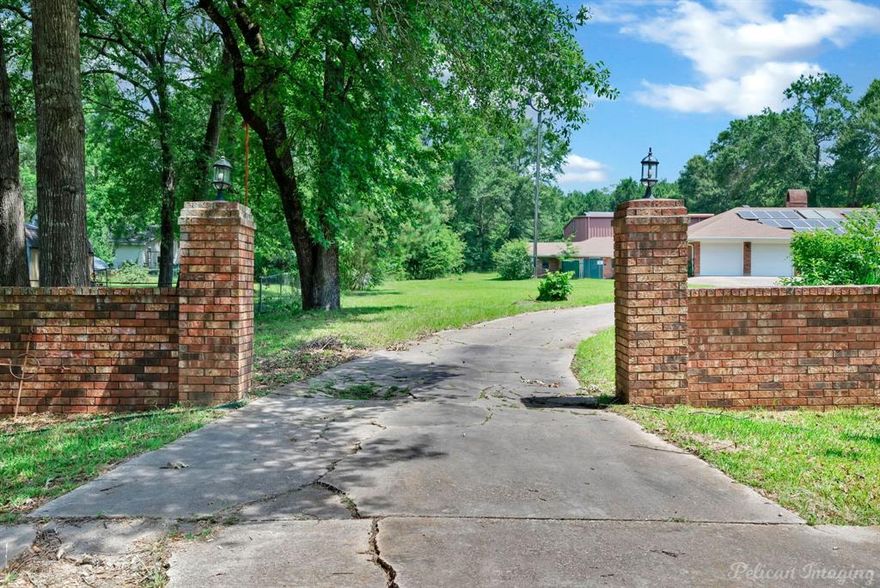 Plenty of room to roam on this two-acre lot in Greenwood, Louisiana. The main house has 2,911 square feet and offers a living room, dining room, four bedrooms, 3.5 bathrooms, extra-large utility room, and an office. This home also offers a 970 square foot separate mother-in-law suite. There is also a 2,000 square foot workshop with 24' ceilings. This home is a short sale and will need some repairs on the guest house, workshop, and grounds.