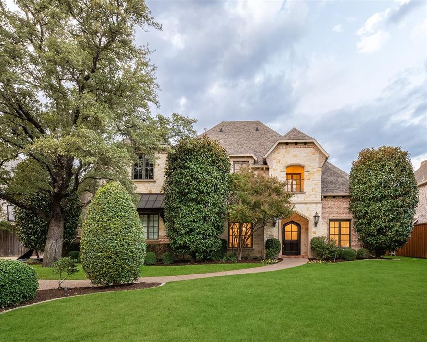 Welcome to this beautifully updated traditional home in a desirable and quiet Preston Hollow neighborhood! With five spacious bedroom suites, a dedicated study, media room, game room, and abundant storage, this home is designed for comfort and style. Recently remodeled to enhance its natural beauty and natural light, it features high-quality construction by David Goettsche of Desco Fine Homes, with thoughtful and extensive updates by the current owners. The main level offers a generously sized and updated kitchen and family room space plus an open club room with a wet bar and wine storage, all with seamless access to the outdoor spaces. The open layout provides multiple living spaces, including two bedrooms down: a downstairs guest suite, plus the primary suite with a sitting area, spacious bath with dual sinks, a separate tub and shower, and a large walk-in closet. Upstairs, you’ll find three more bedroom suites, a media room, a game room, and air-conditioned storage. Up and down laundry. The outdoor area is perfect for entertaining, with a covered patio featuring a fireplace, a dining area, a grill, a pool, and a yard. 3 car garage plus extra parking. This location on a private street offers close proximity to Central Market, Preston Royal shopping, Starbucks and top private schools. It’s a move-in-ready home in a prime location!