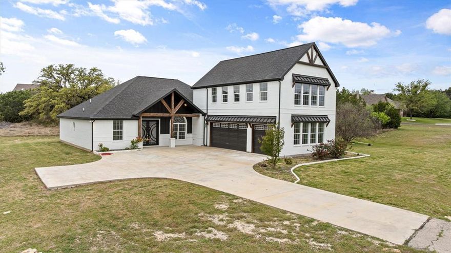 Welcome to this stunning modern farmhouse situated on a spacious homesite, offering the perfect blend of timeless charm and contemporary design. This beautifully crafted home features striking white brick exterior, bold black accents, and inviting wood beam details that create exceptional curb appeal.
Step inside to discover an open-concept layout designed for both everyday living and entertaining. The home offers a seamless flow between the living, dining, and kitchen areas, complemented by abundant natural light and thoughtfully designed finishes throughout.
The spacious primary suite provides a private retreat, while additional bedrooms offer flexibility for family, guests, or a home office. A large attached garage and extended driveway provide ample parking and functionality.
Enjoy peaceful outdoor living with plenty of room for entertainment, or simply take in the surrounding Texas landscape. Whether you’re looking for quiet country-style living or a stylish place to host, this property delivers.
Conveniently located with easy access to nearby amenities while still offering privacy and space—this is modern farmhouse living at its best