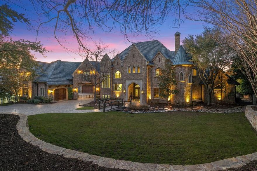 A rare opportunity in Frisco’s prestigious community of Starwood, this George Fuller custom estate is set on an exceptional 1.08 ac lot, offering space, privacy and outdoor living seldom available. Encompassing over 8,000 square feet, the home features 5 bdrms, 5 full baths, 2 half baths and a floor plan ideal for everyday living and large-scale entertaining.An electric gate provides access to the porte-cochère and four-car garage. Inside, elegant living spaces include a formal dining room, expansive family room with fireplace and wet bar, and a chef’s kitchen with large island, breakfast bar, Wolf six-burner gas range, built-in refrigerator, two dishwashers, a separate ice maker and dual refrigerated drawers integrated into custom cabinetry, plus a separate catering kitchen with sink and warming drawer. The breakfast nook has a cozy fireplace and a beautifully hand-painted ceiling. A striking 2-story library features a hidden staircase and 2 hidden doors—one leading to a storm-safe room and the other to a temperature-controlled wine cellar capable of storing over 1,000 bottles. The main-level primary is a private retreat with a sitting area and patio access and the bath includes dual vanities, a jetted tub, walk-in shower and a custom closet with pull-down storage. A guest bedroom is also located downstairs. Upstairs includes a game room with pressed metal tile ceiling and screened-balcony overlooking the pool, a tiered media room with wet bar, microwave and mini fridge, three additional ensuite bedrooms, and a large flex room ideal for a craft room, fitness space or studio. The property is designed for outdoor enjoyment with a covered patio, a separate outdoor kitchen with built-in grill, bar, fireplace with TV, a gazebo and ample space for recreation and pets. Community amenities incl trails, tennis courts, clubhouse, pool, fitness center and convenient access to shopping, dining, top-rated schools, the Tollway, Legacy West, The Star and PGA District.
