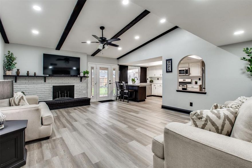 Welcome to 2034 Lewis Trail in Grand Prairie, a beautifully updated, move-in-ready home featuring clean, modern finishes and upgrades throughout. The bright, open floorplan is designed for comfortable everyday living and entertaining, with a spacious main living area anchored by a fireplace that flows easily into the kitchen and dining spaces. A second large living area provides flexible space ideal for a home office, media room, or additional entertaining area.
Designer finish-outs can be found throughout the home, including remodeled bathrooms, updated vanities, designer lighting, and all new interior doors.

The home also offers a fantastic indoor-outdoor entertaining setup with a covered outdoor deck and a bar-style countertop connecting the kitchen to the outdoor space—perfect for serving guests and hosting gatherings. The garage has been upgraded with durable epoxy flooring.

Situated on a wide lot with mature trees and alley access in well-established Trailwood, and conveniently close to schools, shopping, dining, and major highways, this home offers style, comfort, and convenience in the heart of Grand Prairie.