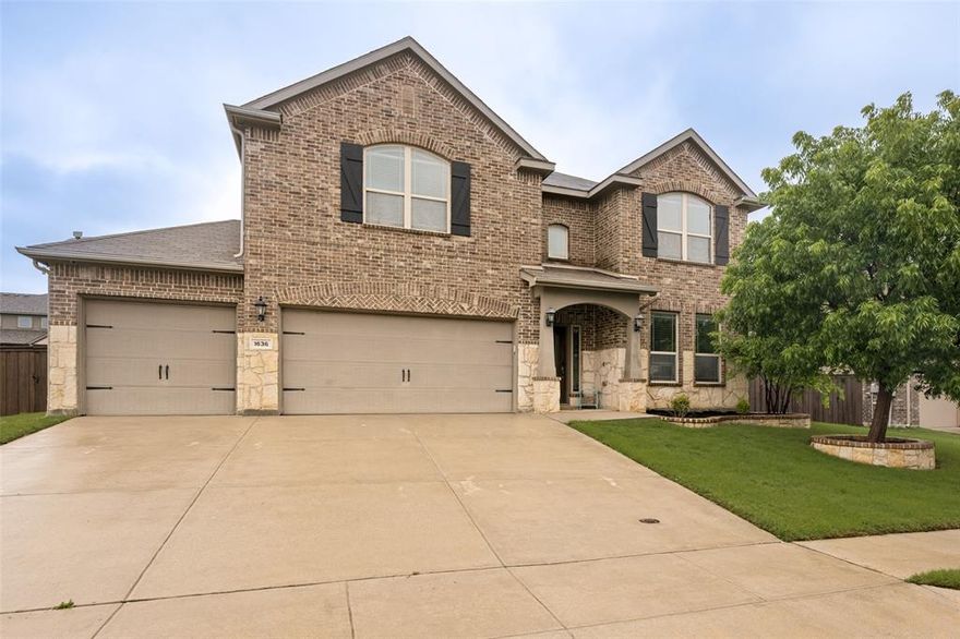 Nestled in the master-planned community of Sendera Ranch and zoned to acclaimed Northwest Independent School District, this exceptional 4-bedroom, 2.5-bath, 3-car garage home blends timeless craftsmanship with everyday luxury. The full brick exterior with rich stone accents, custom stone-and-brick flowerbeds, mature shade tree, and inviting covered front porch create standout curb appeal and a warm welcome. Jellyfish LED decorative lighting offer year-round opportunities to display seasonal or team color lighting at the flip of a switch! Enter through the elegant half-light front door with beveled and frosted glass into a grand foyer featuring oversized ceramic tile, soaring ceilings, and a dramatic art niche designed for showcasing your favorite statement piece. The versatile floorplan offers a private office behind French doors, formal dining for holiday gatherings, and a spacious family room filled with natural light from walls of windows, enhanced by crown molding for a refined finish. The gourmet kitchen is beautifully appointed with granite countertops, custom cabinetry, undermount sink, stainless built-in gas cooktop and oven, and a unique stone backsplash accented with frosted glass windows that flood the workspace with natural light. The charming dining room with window seat creates the perfect place for morning coffee. The private downstairs primary suite offers oversized windows and a spa-inspired bath with soaking tub, glass-enclosed shower, dual granite vanities, and a massive walk-in closet. Upstairs features a large gameroom and 3 oversized secondary bedrooms, each with walk-in closets. Step outside to your backyard oasis with a resort-style pool, tanning ledge, waterfall, and covered patio—perfect for entertaining. Enjoy Sendera Ranch amenities including pools, trails, parks, ponds, and sports courts, with quick access to major employers, shopping, dining, and highways. Homes like this don’t last—schedule your tour today!