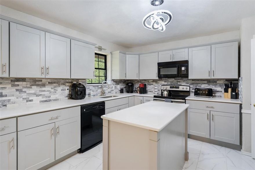 Fully Updated and comfortable home, This house has an AWESOME kitchen with an open concept design into a lofty living room. This house features a newly done bar in the kitchen with marble that goes up the wall. All the counter tops are quartz and even has a quartz island! Great newly built storage shed in the spacious back yard, which would be great for dogs! This house is a must-see for anyone looking for a place to call home!!